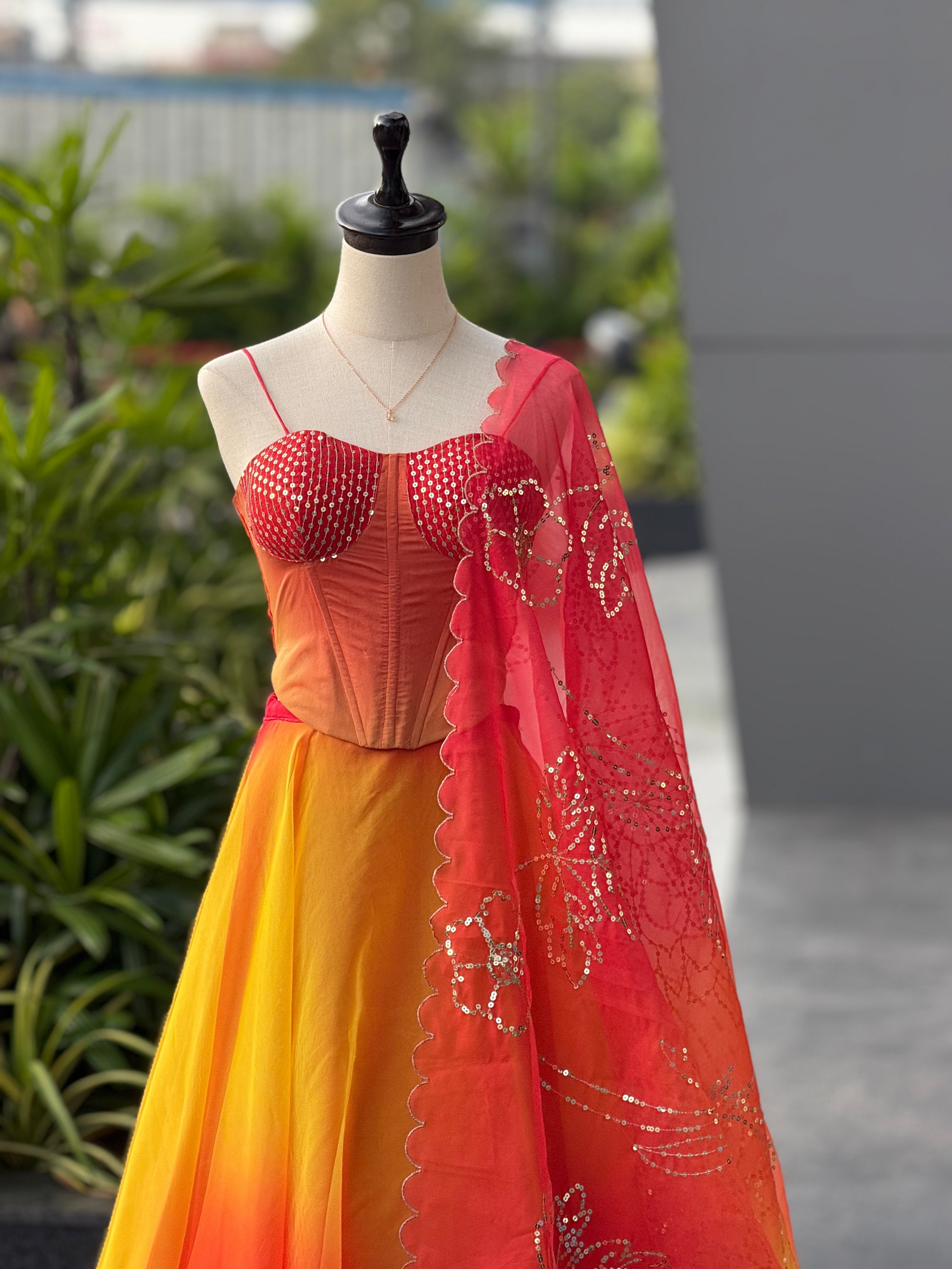 Haldi Function Wear Yellow And Orange Color Lehenga With Trendy Corset Pattern Blouse And Designer Batwa