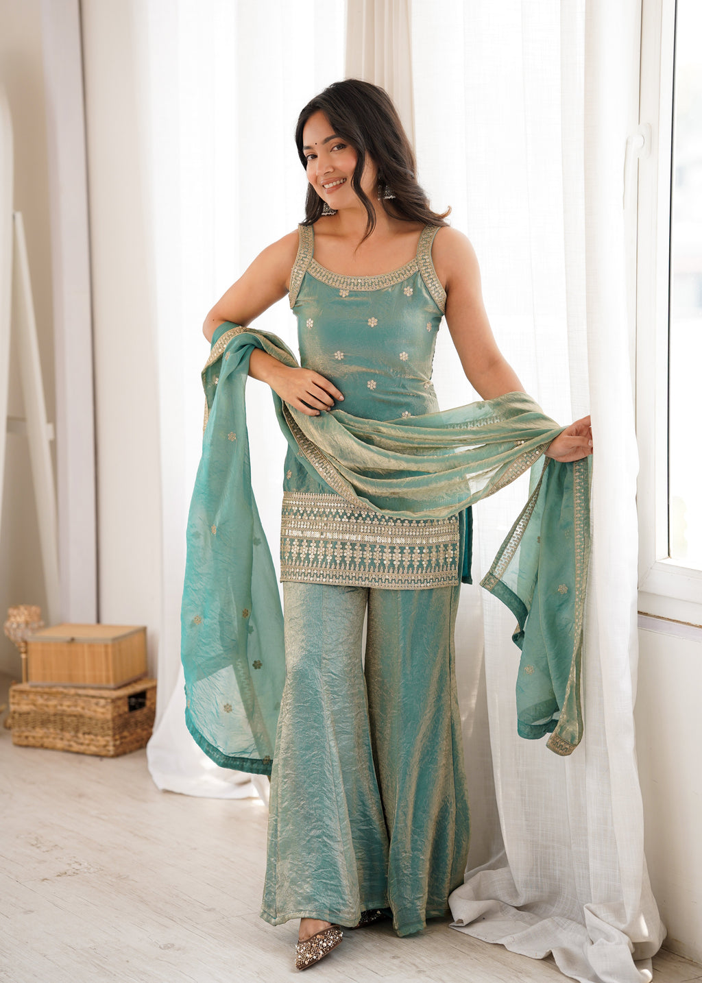 Woman in a stylish suit smiles for a portrait | Sharara Set For Women