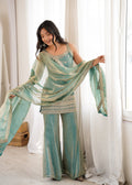 Woman in a stylish suit smiles for a portrait | Sharara Set For Women