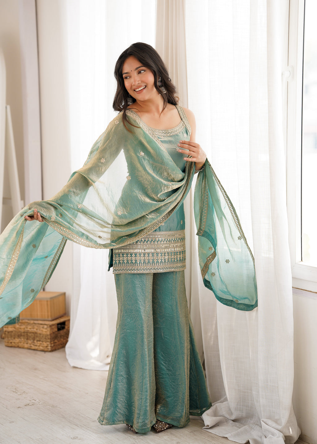 Woman in a stylish suit smiles for a portrait | Sharara Set For Women