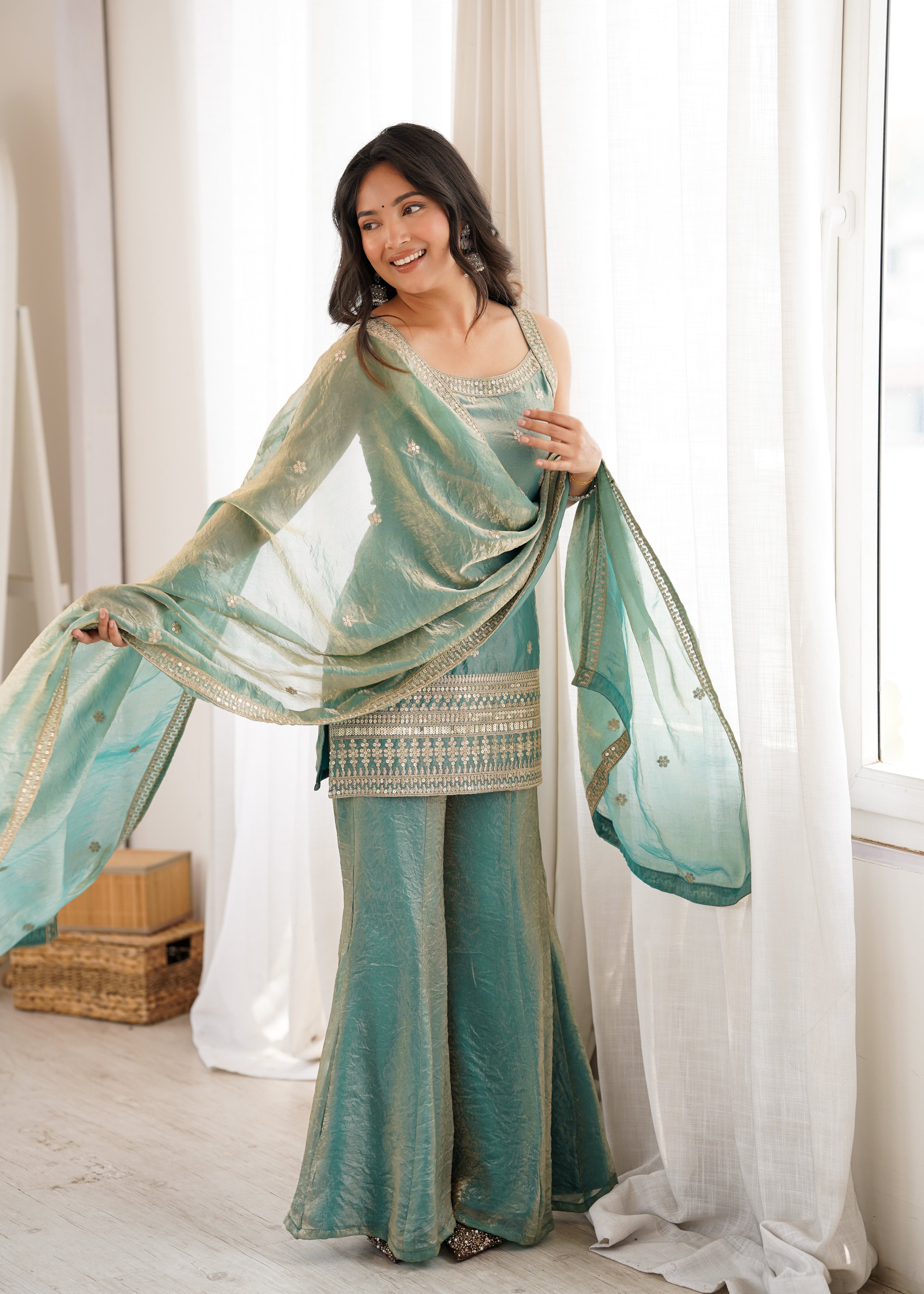 Woman in a stylish suit smiles for a portrait | Sharara Set For Women