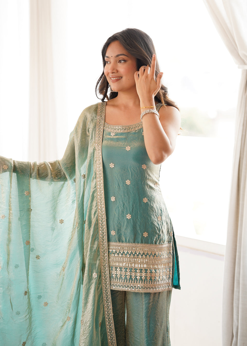 Woman in a stylish suit smiles for a portrait | Sharara Set For Women
