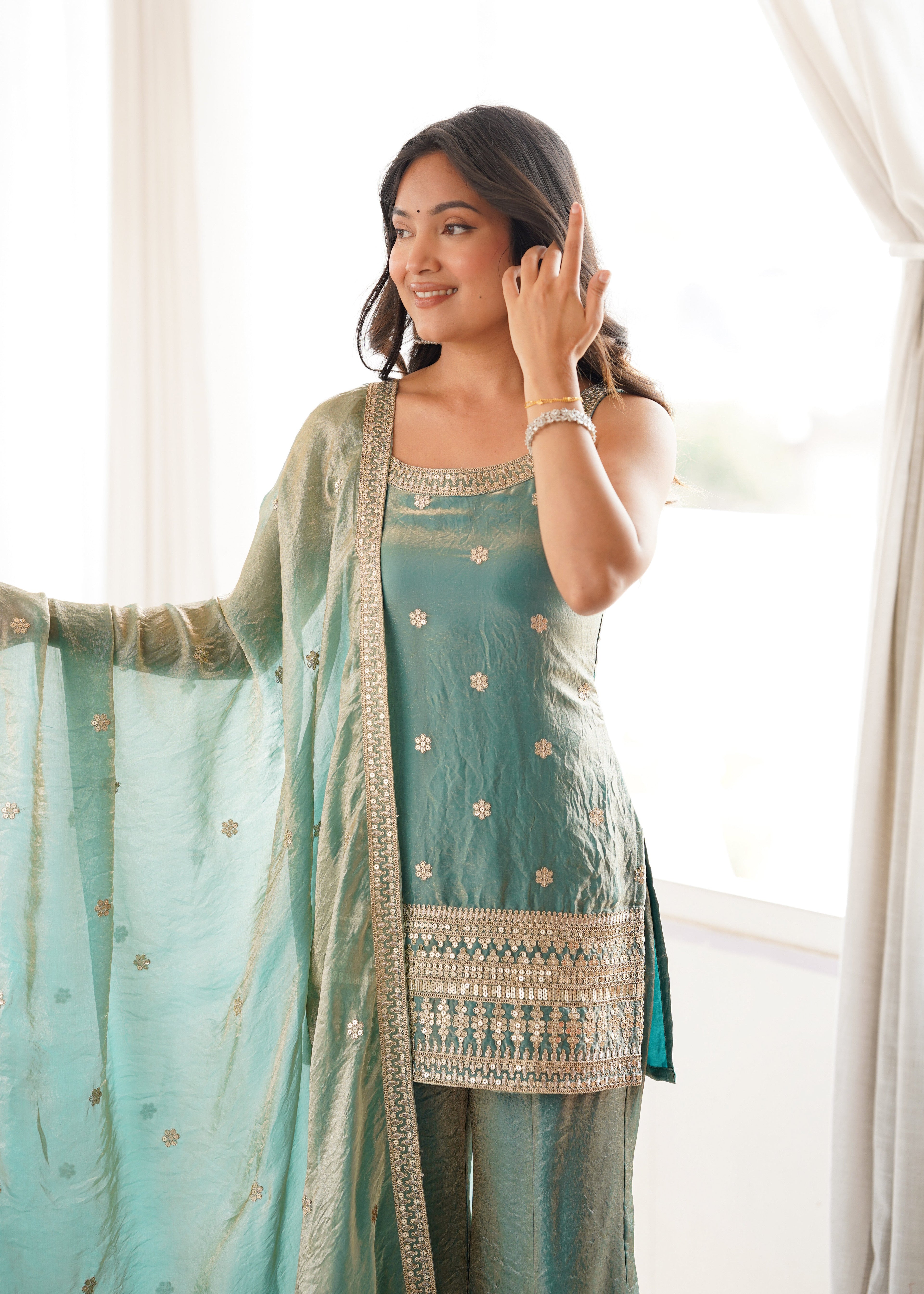 Woman in a stylish suit smiles for a portrait | Sharara Set For Women