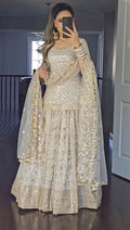 Captivating Embroidery Work White Color Lehenga Suit